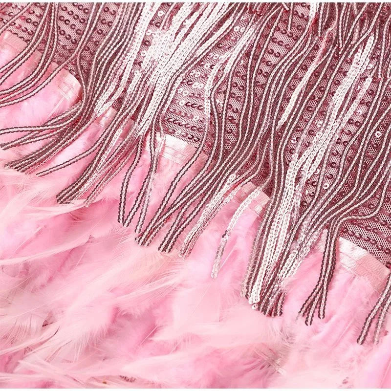 Pink fringe dress by Ilynora, close-up showing detailed fringe texture and soft finish