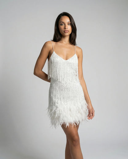 Women's feather trim fringe mini dress in white by Ilynora, front view with slim fit and soft movement