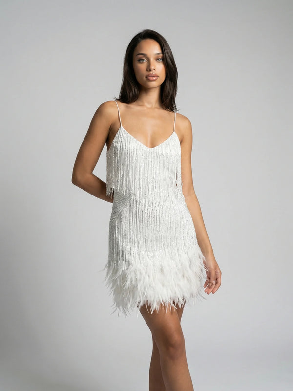 Women's feather trim fringe mini dress in white by Ilynora, front view with slim fit and soft movement