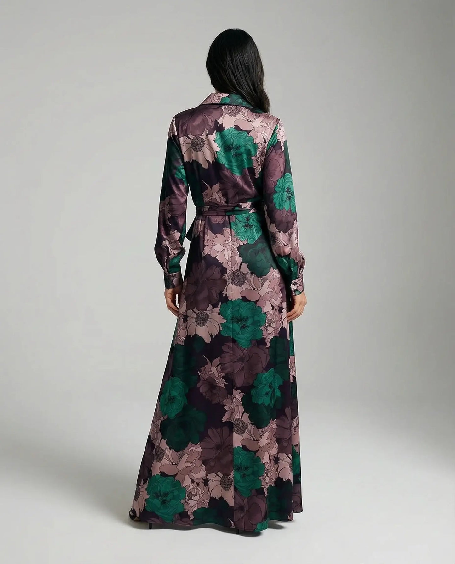 Floral maxi dress with belt by Ilynora, back view highlighting long length and elegant movement