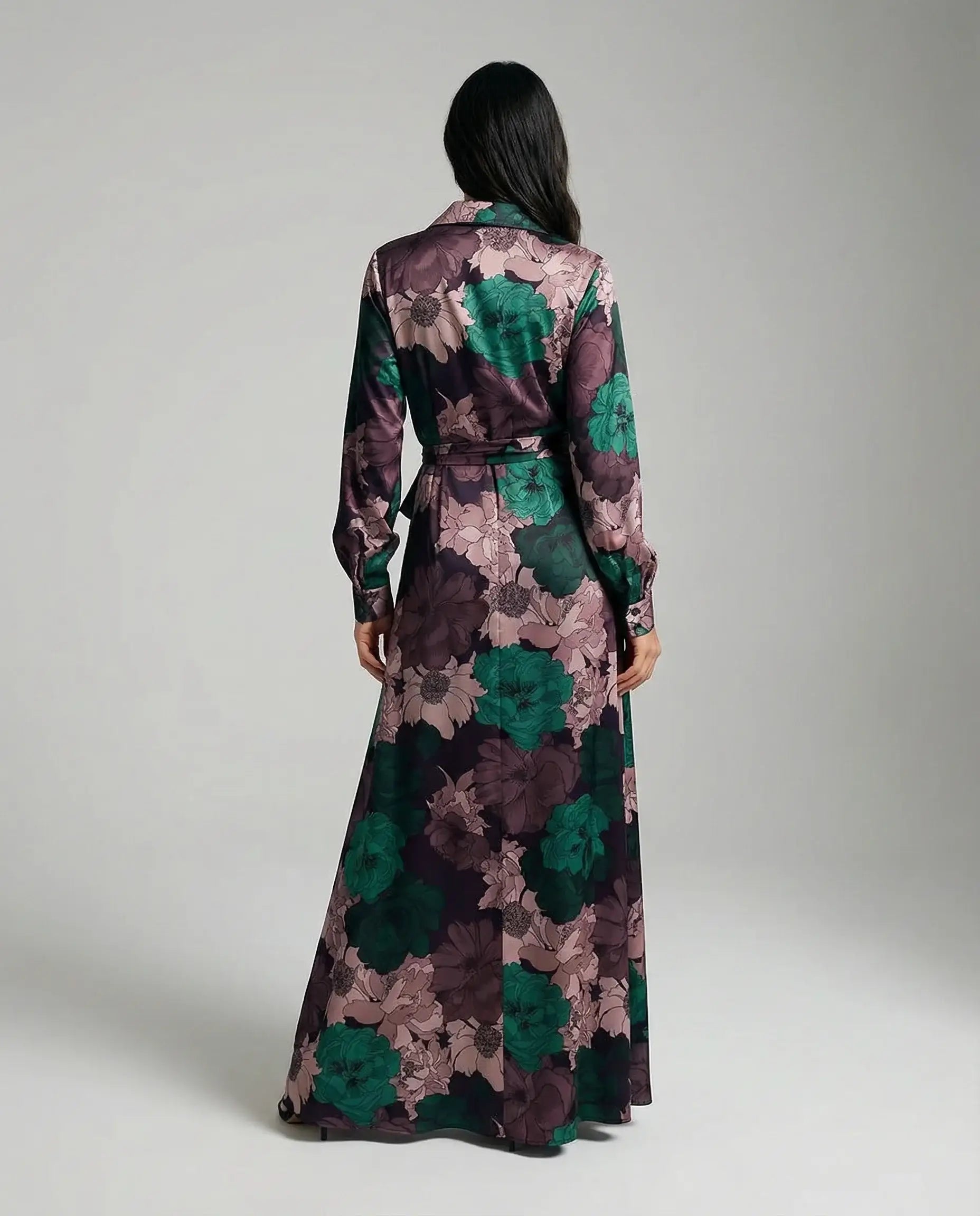 Floral maxi dress with belt by Ilynora, back view highlighting long length and elegant movement