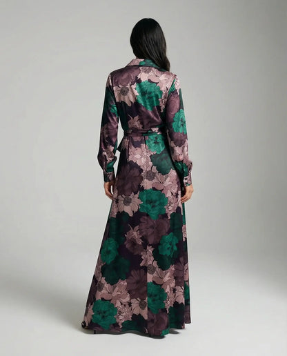 Floral maxi dress with belt by Ilynora, back view highlighting long length and elegant movement