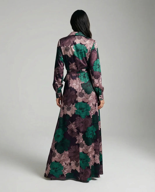 Floral maxi dress with belt by Ilynora, back view highlighting long length and elegant movement