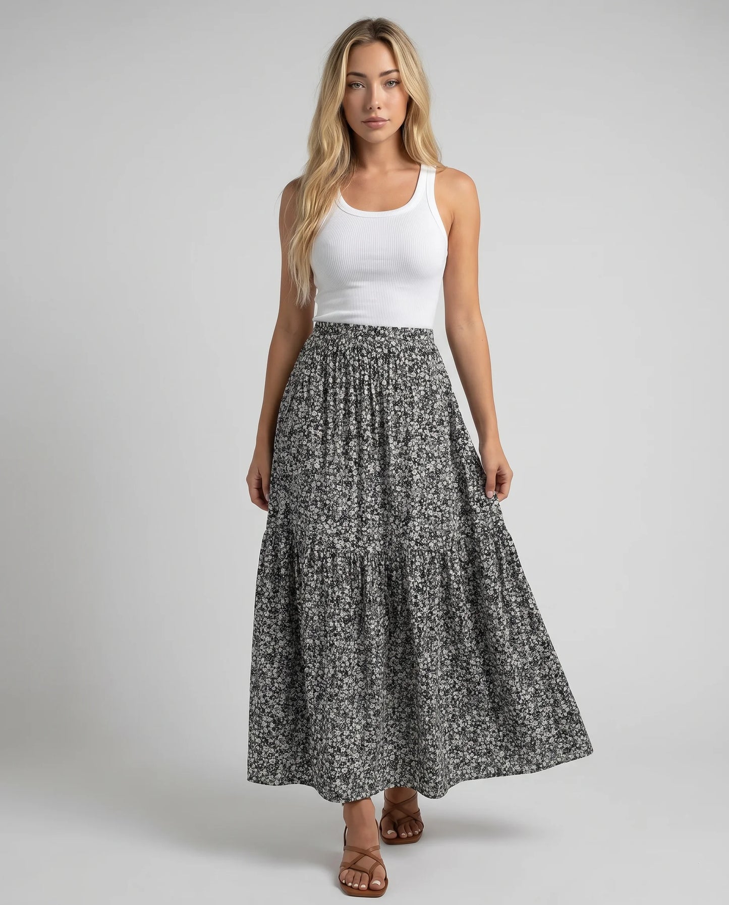 Women's black floral midi skirt with tiered design and timeless everyday elegance by ILYNORA