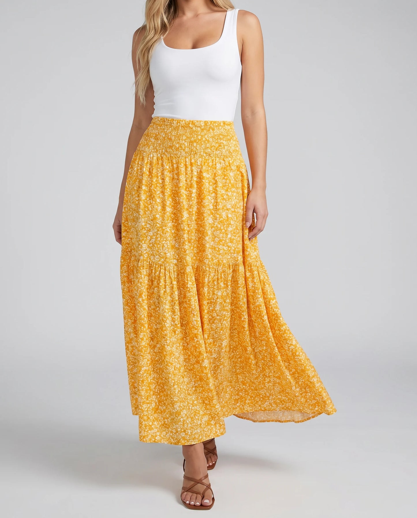 Women's yellow floral midi skirt with flowing shape and feminine summer styling by ILYNORA