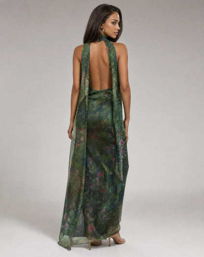 Women's dark green floral maxi dress with open back design and graceful chiffon movement by ILYNORA
