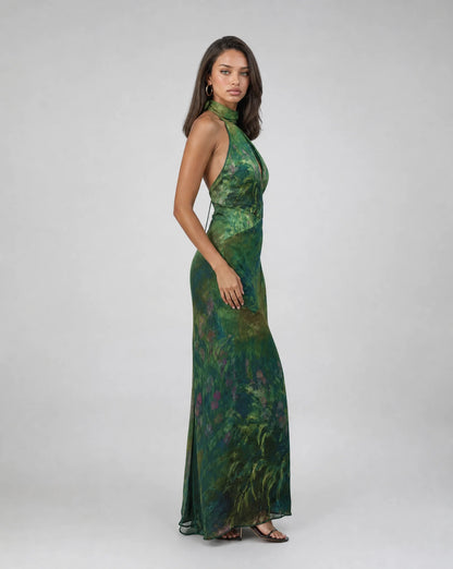 Women's dark green floral occasion dress with halter neckline and sophisticated evening style by ILYNORA