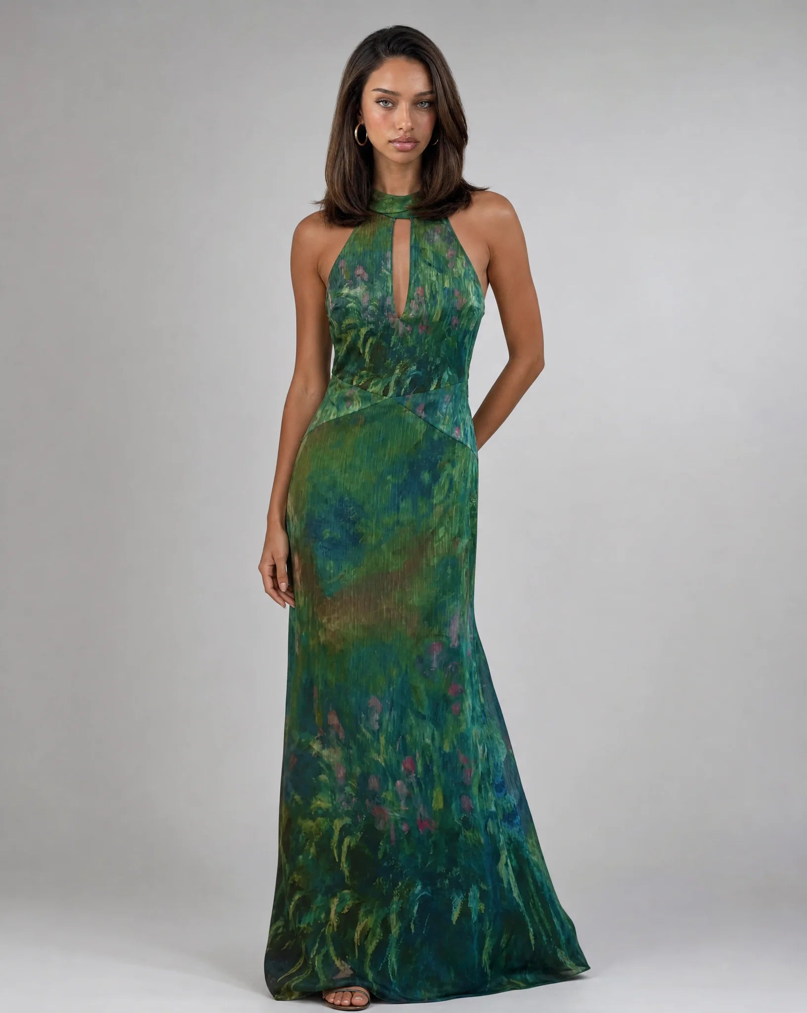 Women's dark green floral occasion maxi dress with artistic print and elegant flowing silhouette by ILYNORA