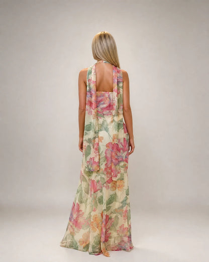 Creme floral scarf neck maxi dress back view with open back detail and flowing silhouette by ILYNORA
