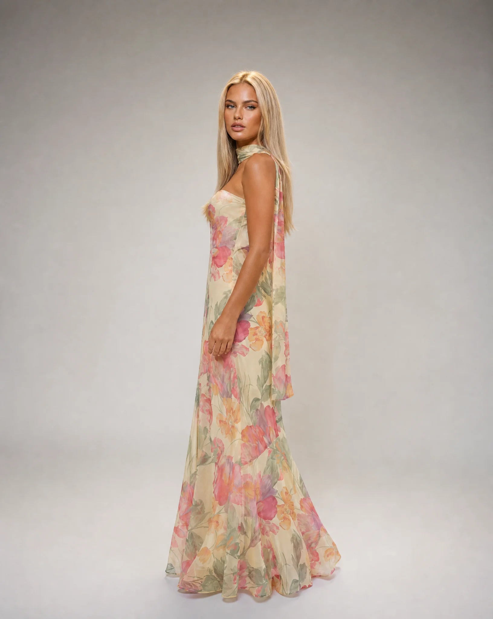 Creme floral scarf neck maxi dress side view with fitted bodice and romantic occasion wear by ILYNORA