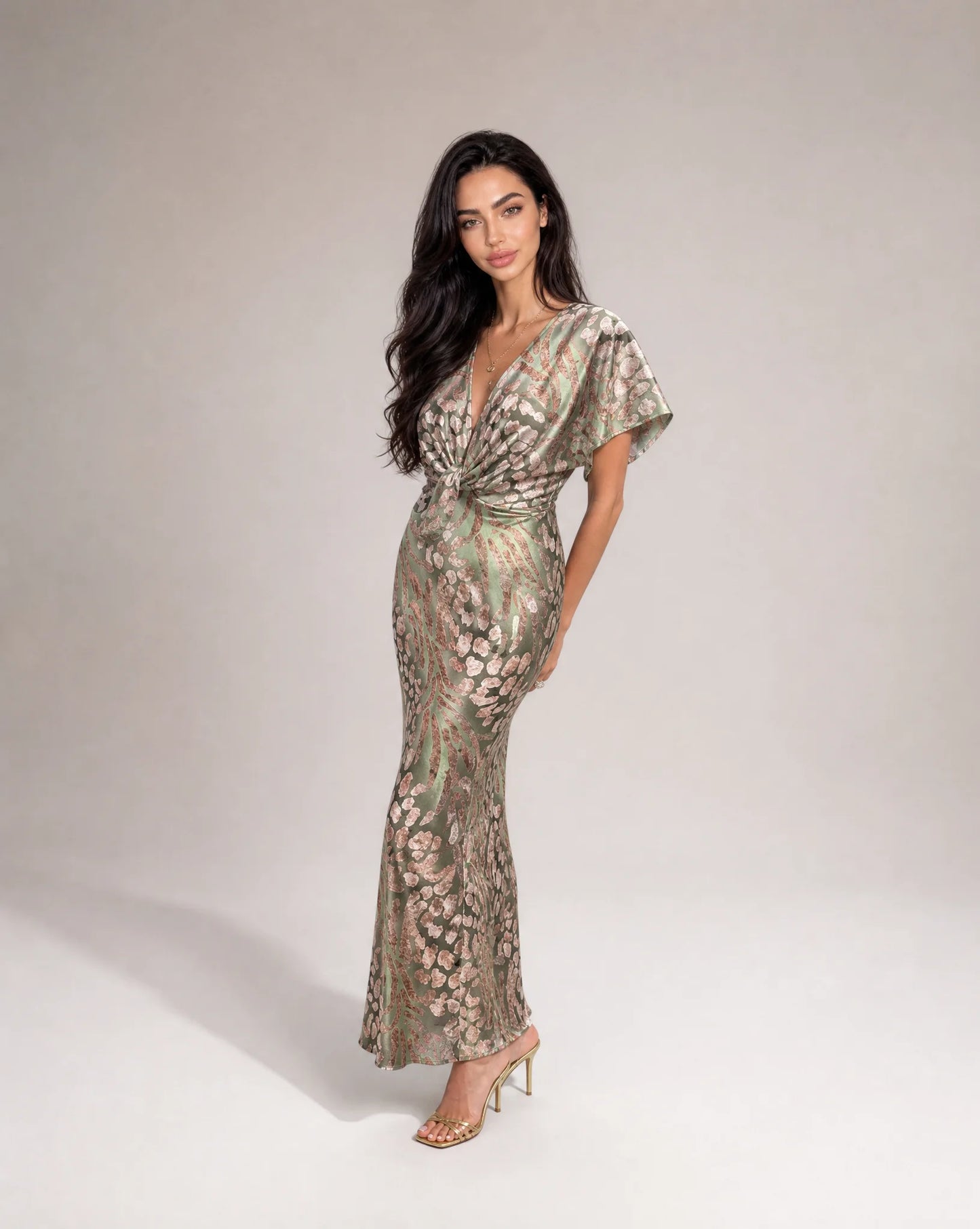 Light green floral maxi dress with flattering twist front and flowing wedding guest silhouette by ILYNORA