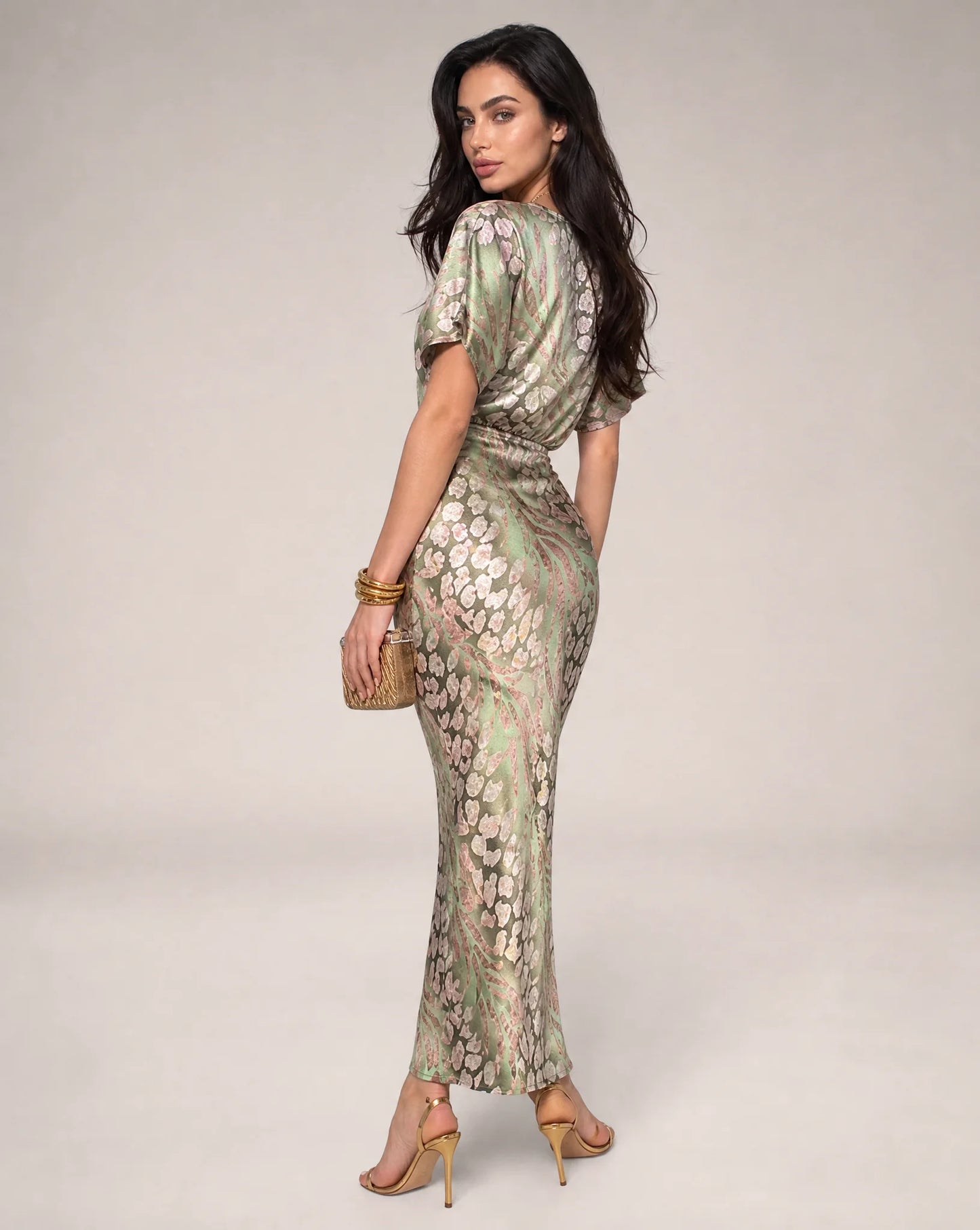 Light green floral wedding guest maxi dress side view with fitted waist and elegant draped design by ILYNORA