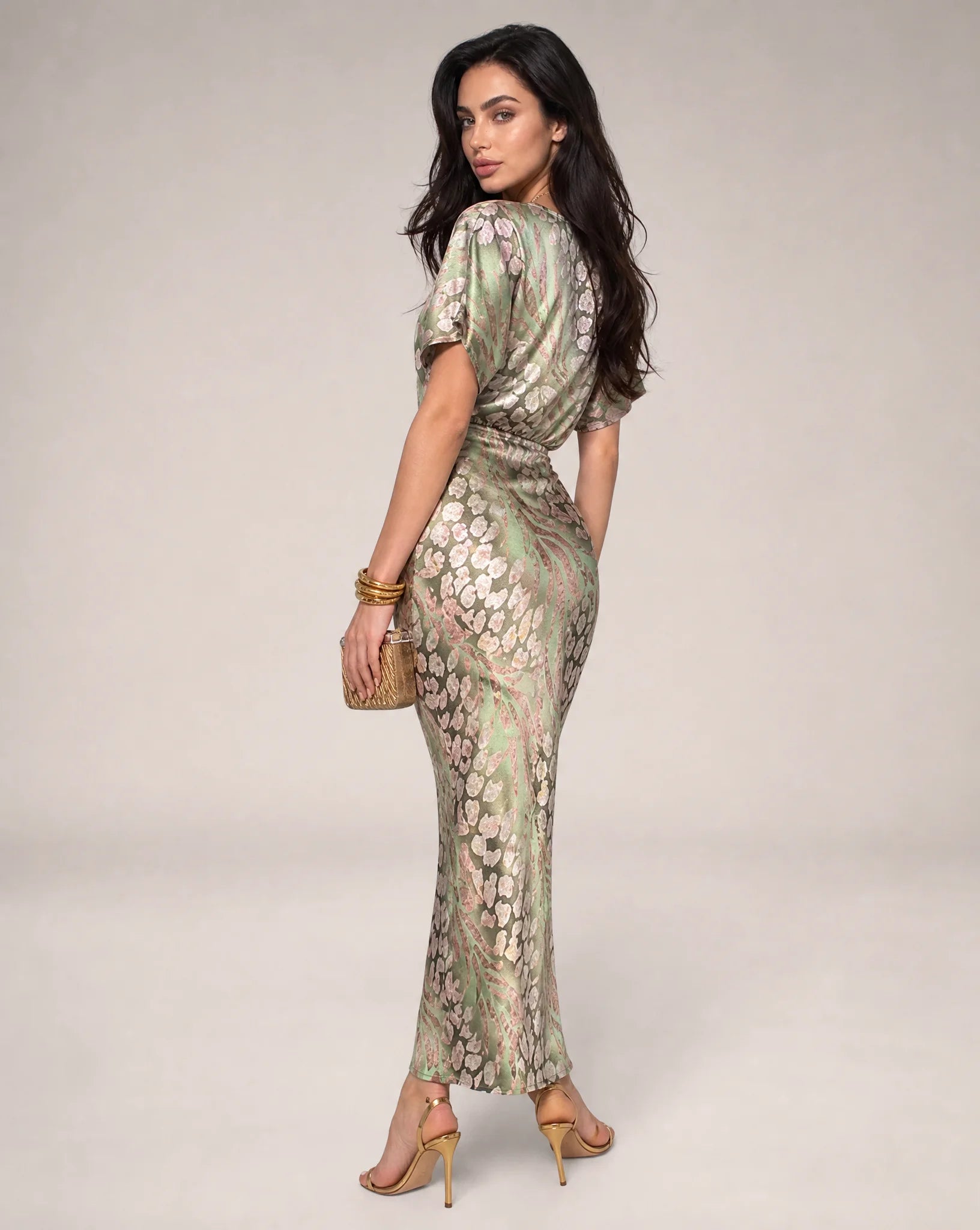 Light green floral wedding guest maxi dress side view with fitted waist and elegant draped design by ILYNORA