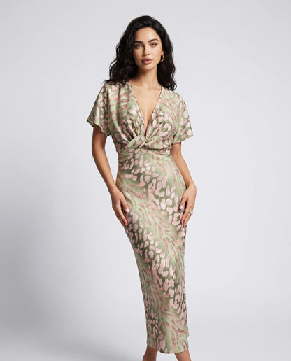 Light green floral wedding guest maxi dress with twist front detail and elegant V neckline by ILYNORA