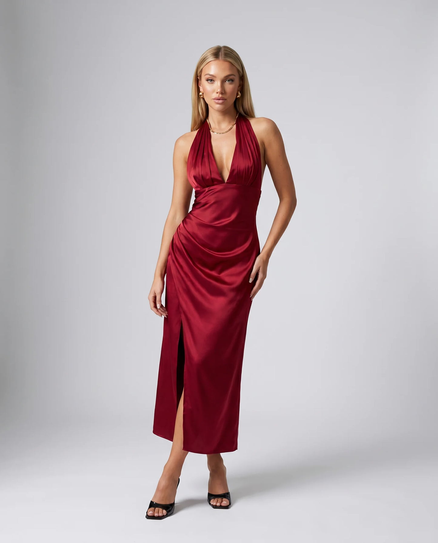 Red halterneck satin maxi dress for women by Ilynora, front view with elegant draping and flowing silhouette