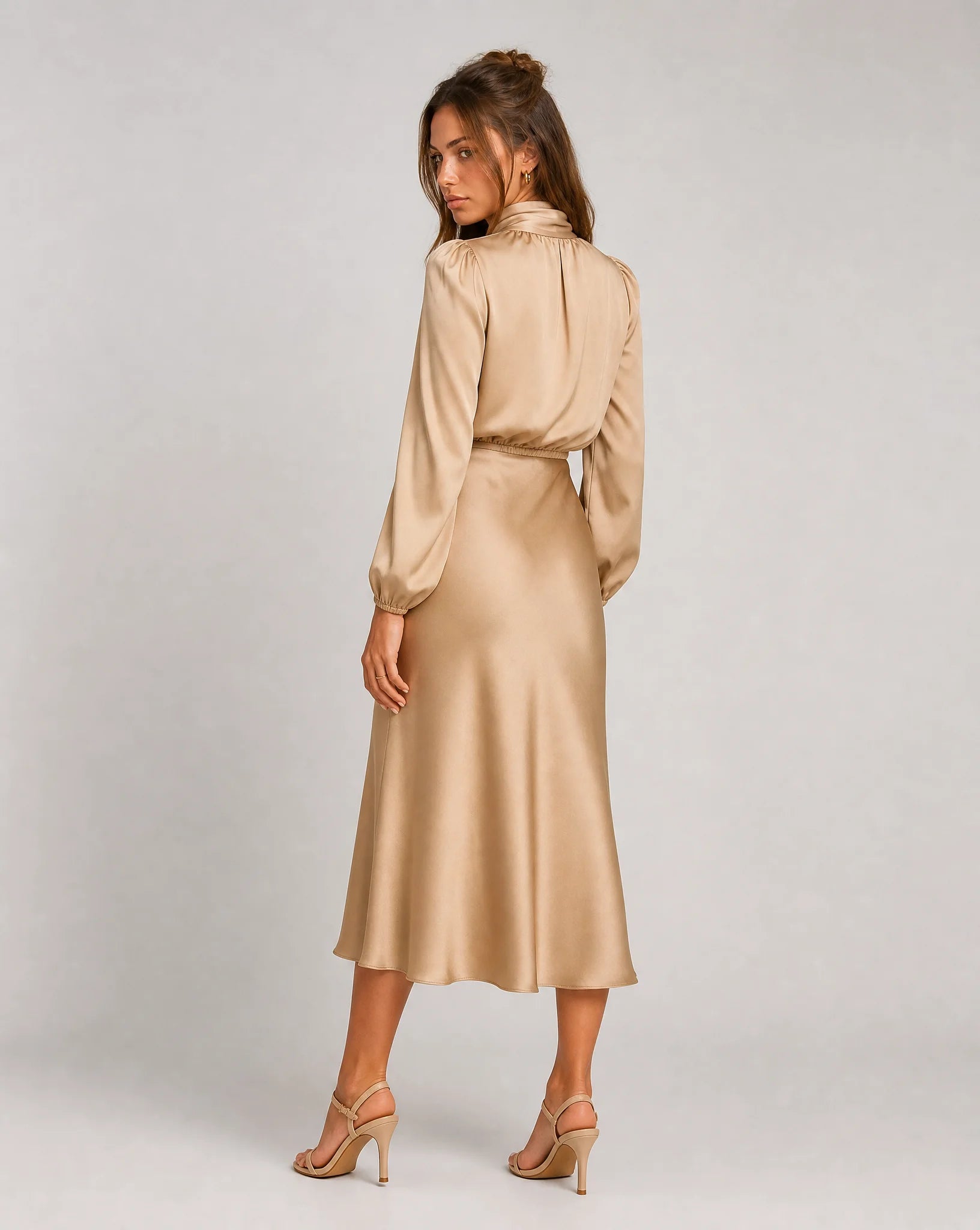 Beige high neck long sleeve midi dress side view with flowing skirt and refined silhouette by ILYNORA