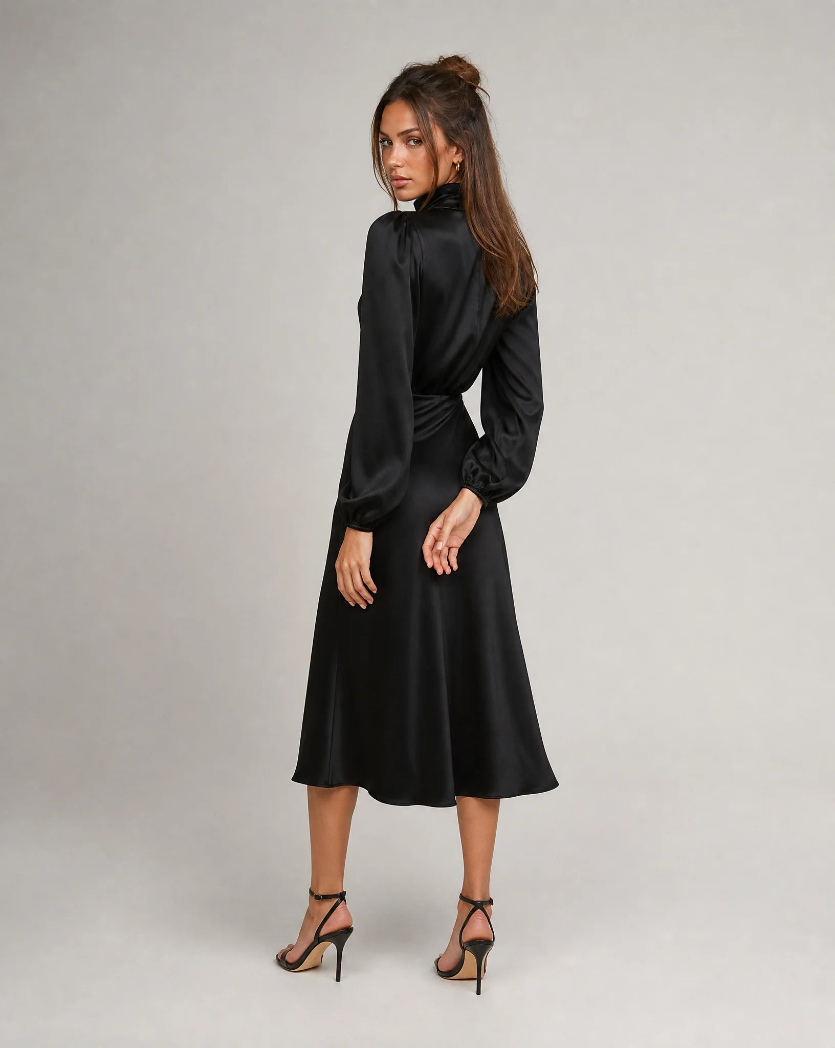 Black high neck long sleeve midi dress back view with elegant drape and formal event styling by ILYNORA
