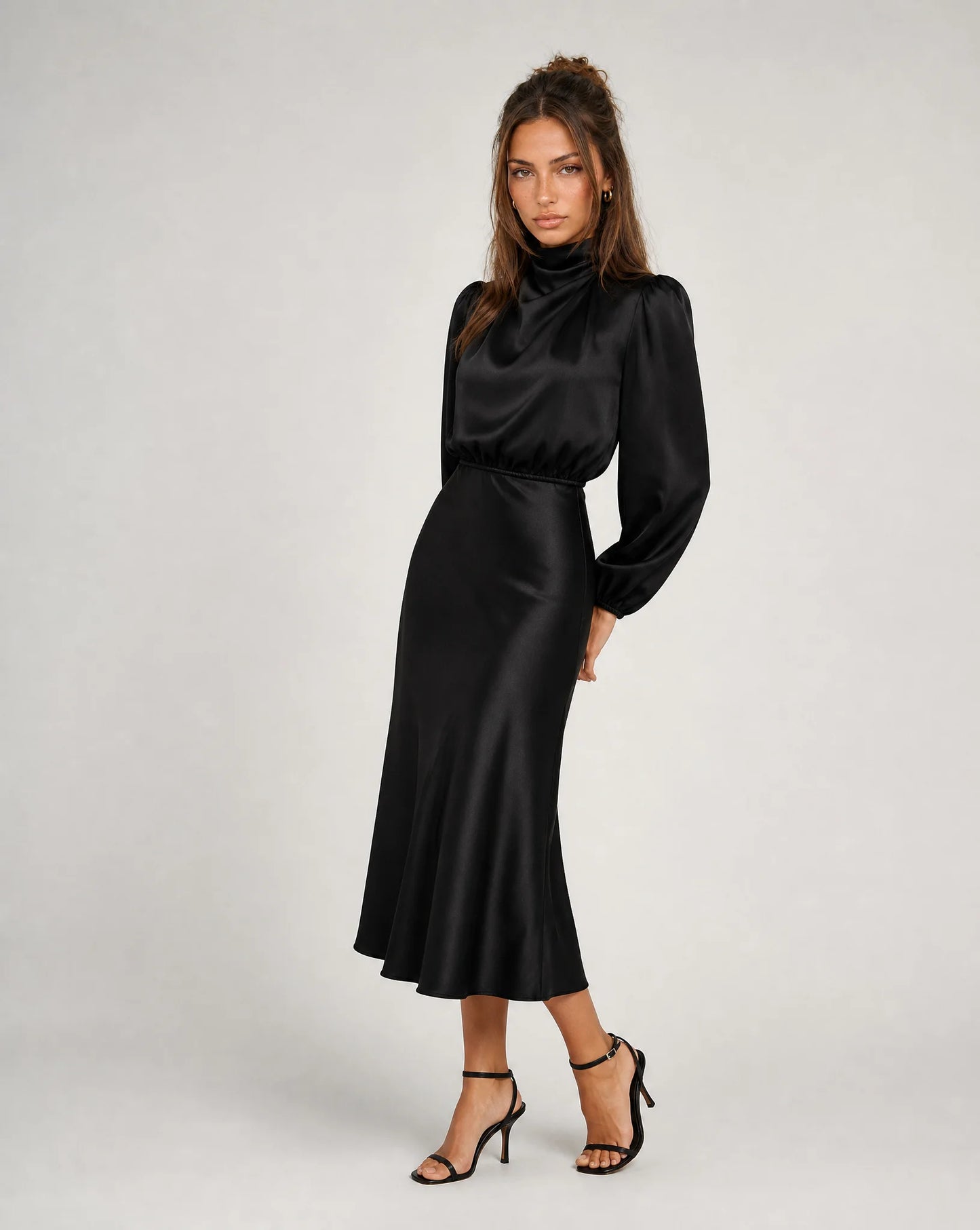 Black high neck long sleeve midi dress with fitted waist and timeless evening wear styling by ILYNORA