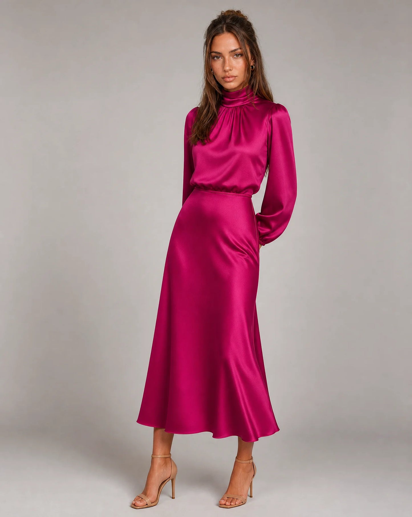 Hot pink high neck long sleeve midi dress with fitted waist and statement occasion styling by ILYNORA