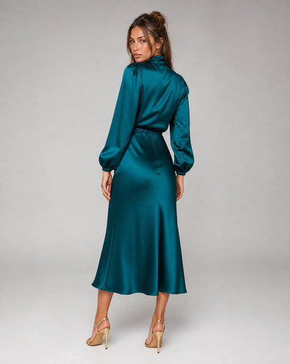 Teal blue high neck long sleeve midi dress back view with flowing silhouette and elegant styling by ILYNORA