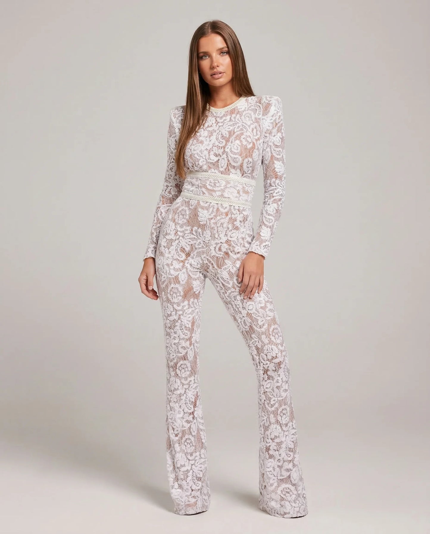 Women's lace flare leg jumpsuit in white by Ilynora, front view with fitted bodice and flared legs