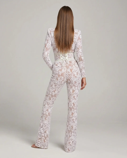 White lace flare jumpsuit by Ilynora, back view highlighting sculpted waist and elegant silhouette