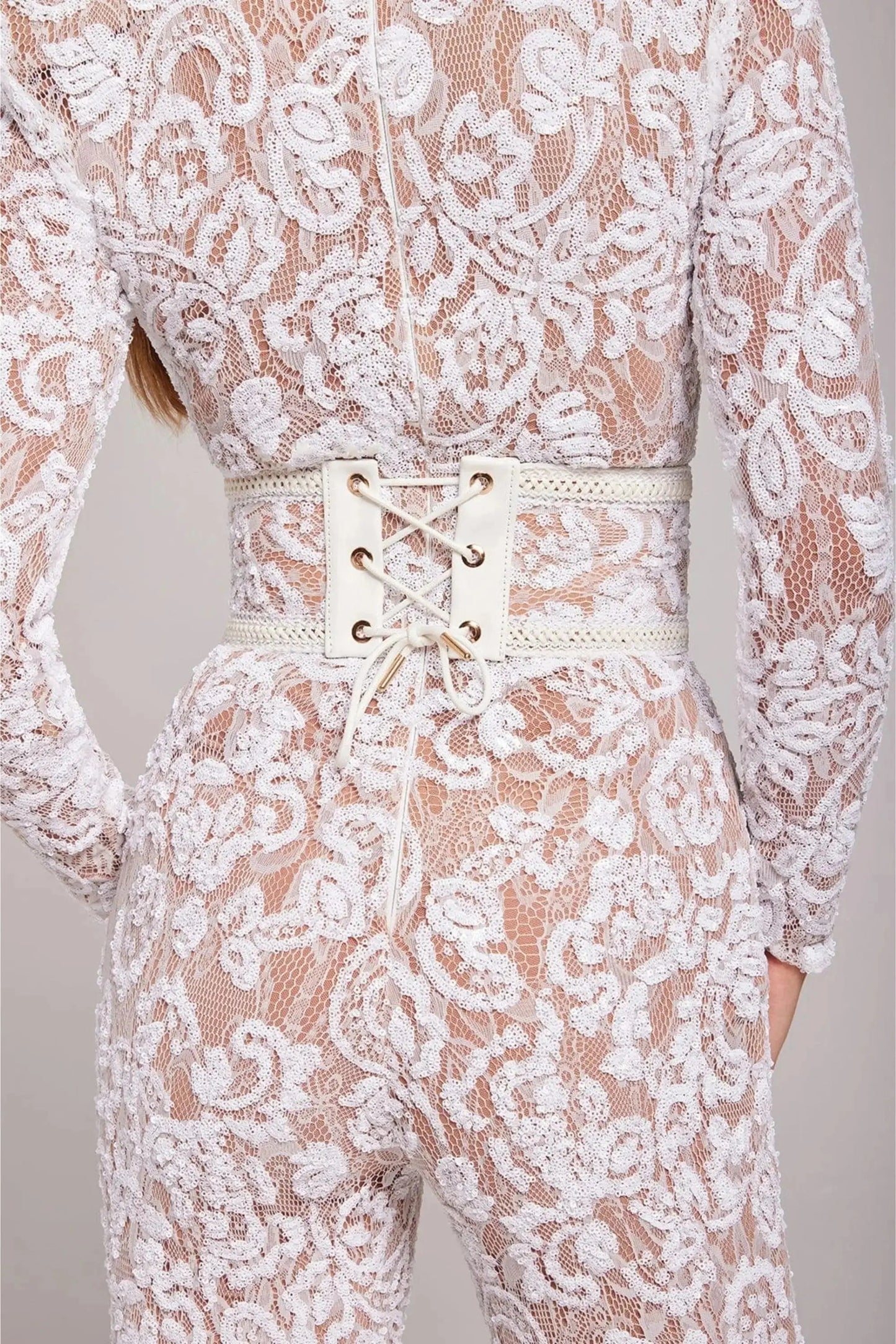 White long sleeve lace jumpsuit by Ilynora, full body view with high neckline and tailored fit
