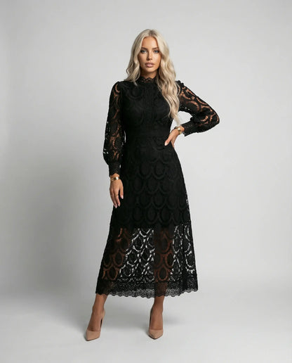 Black lace long sleeve midi dress for women by Ilynora London, elegant fitted design for special occasions