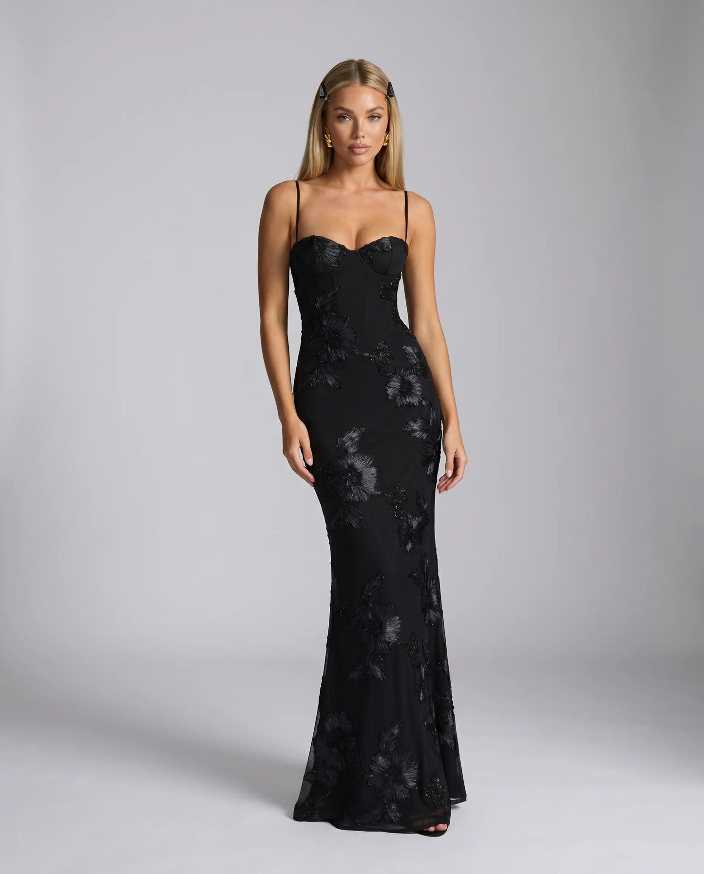 Black floral lace up back maxi dress with fitted silhouette and elegant evening styling by ILYNORA