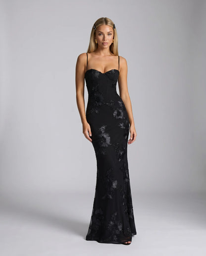 Black floral lace up back maxi dress with fitted silhouette and elegant evening styling by ILYNORA