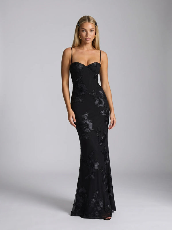 Black floral lace up back maxi dress with fitted silhouette and elegant evening styling by ILYNORA
