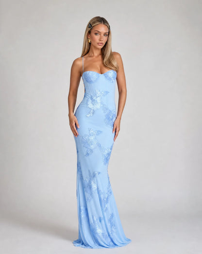 Light blue floral lace up back maxi dress with fitted silhouette and wedding guest styling by ILYNORA