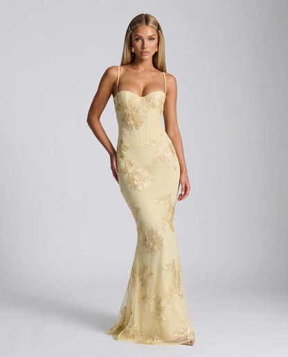 Yellow floral lace up back maxi dress with fitted bodice and elegant occasion wear by ILYNORA