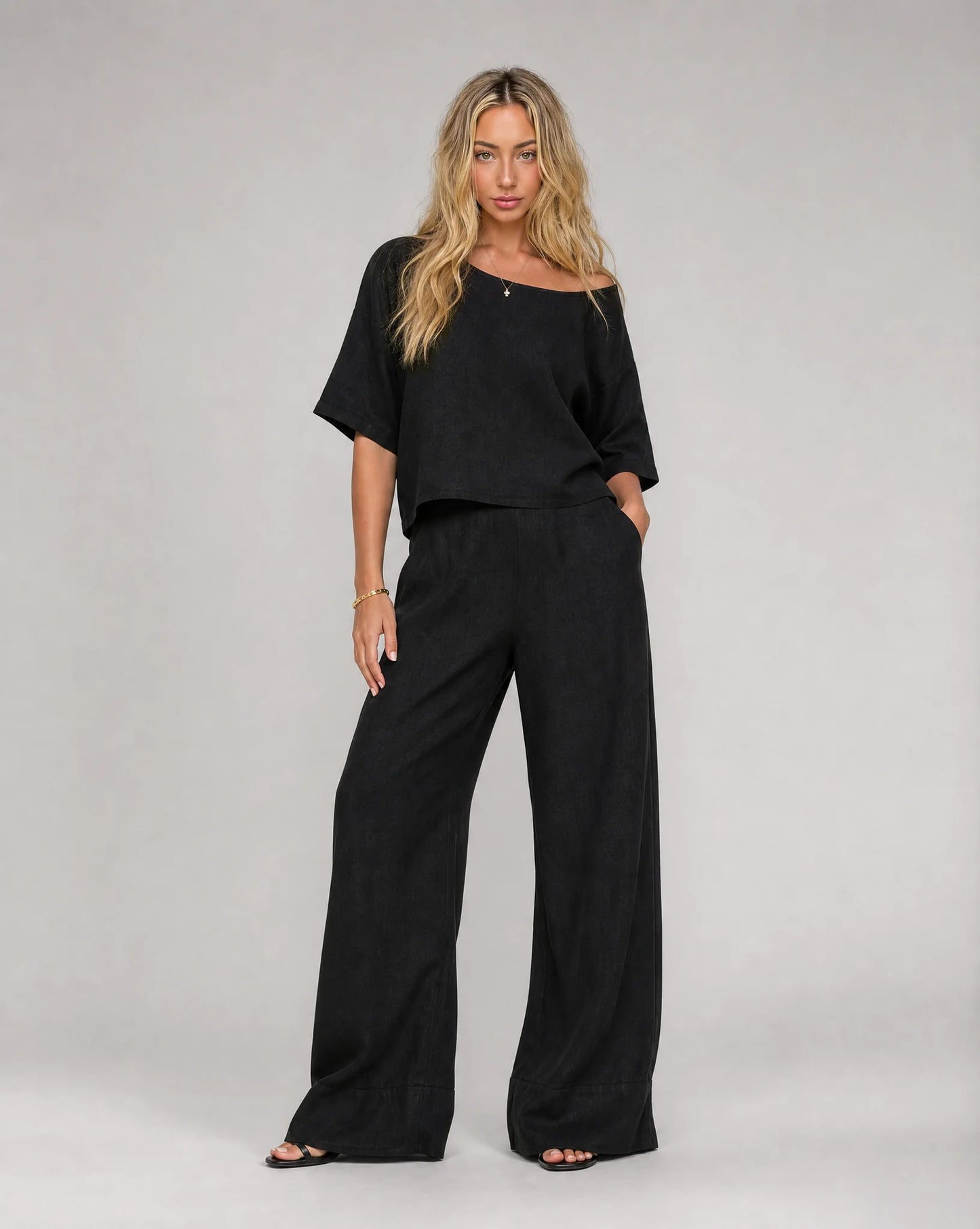 Women's black linen wide leg trouser set with matching short sleeve top by ILYNORA