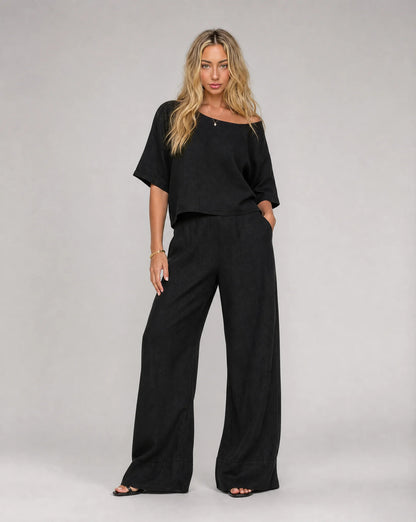 Women's black linen wide leg trouser set with matching short sleeve top by ILYNORA