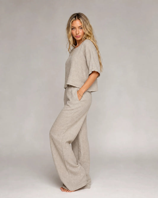 Women's light grey linen two piece set with wide leg trousers and short sleeve top by ILYNORA