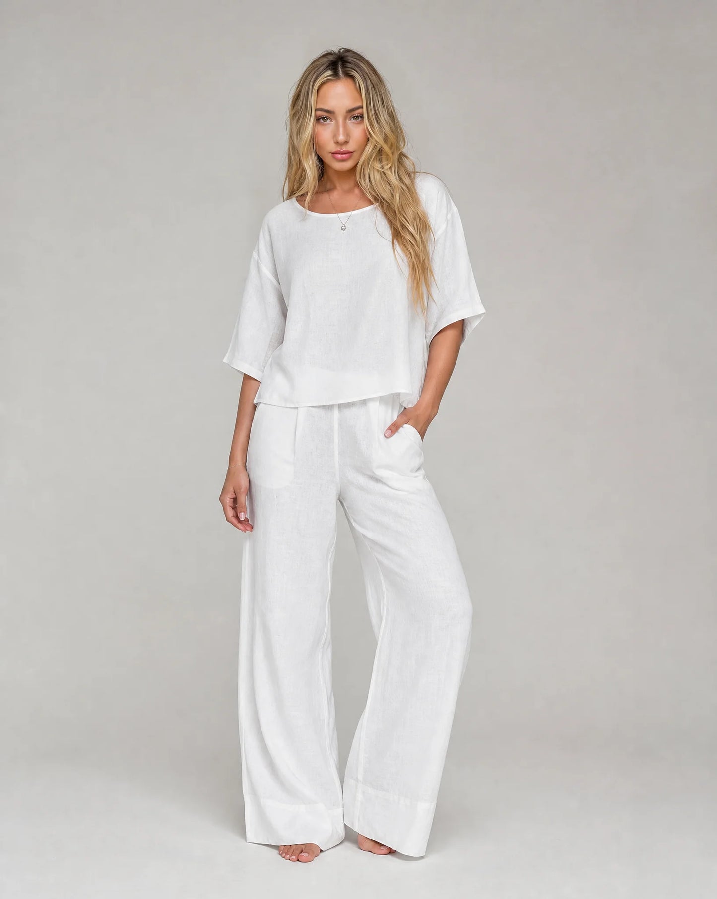Women's white linen wide leg summer trouser set with relaxed fit and matching top by ILYNORA