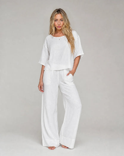 Women's white linen wide leg summer trouser set with relaxed fit and matching top by ILYNORA