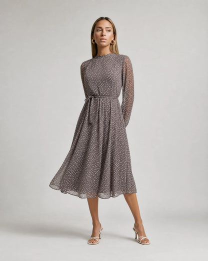 Women's grey long sleeve polka dot midi dress with flowing silhouette and elegant style by ILYNORA