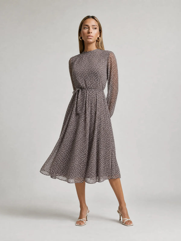 Women's grey long sleeve polka dot midi dress with flowing silhouette and elegant style by ILYNORA