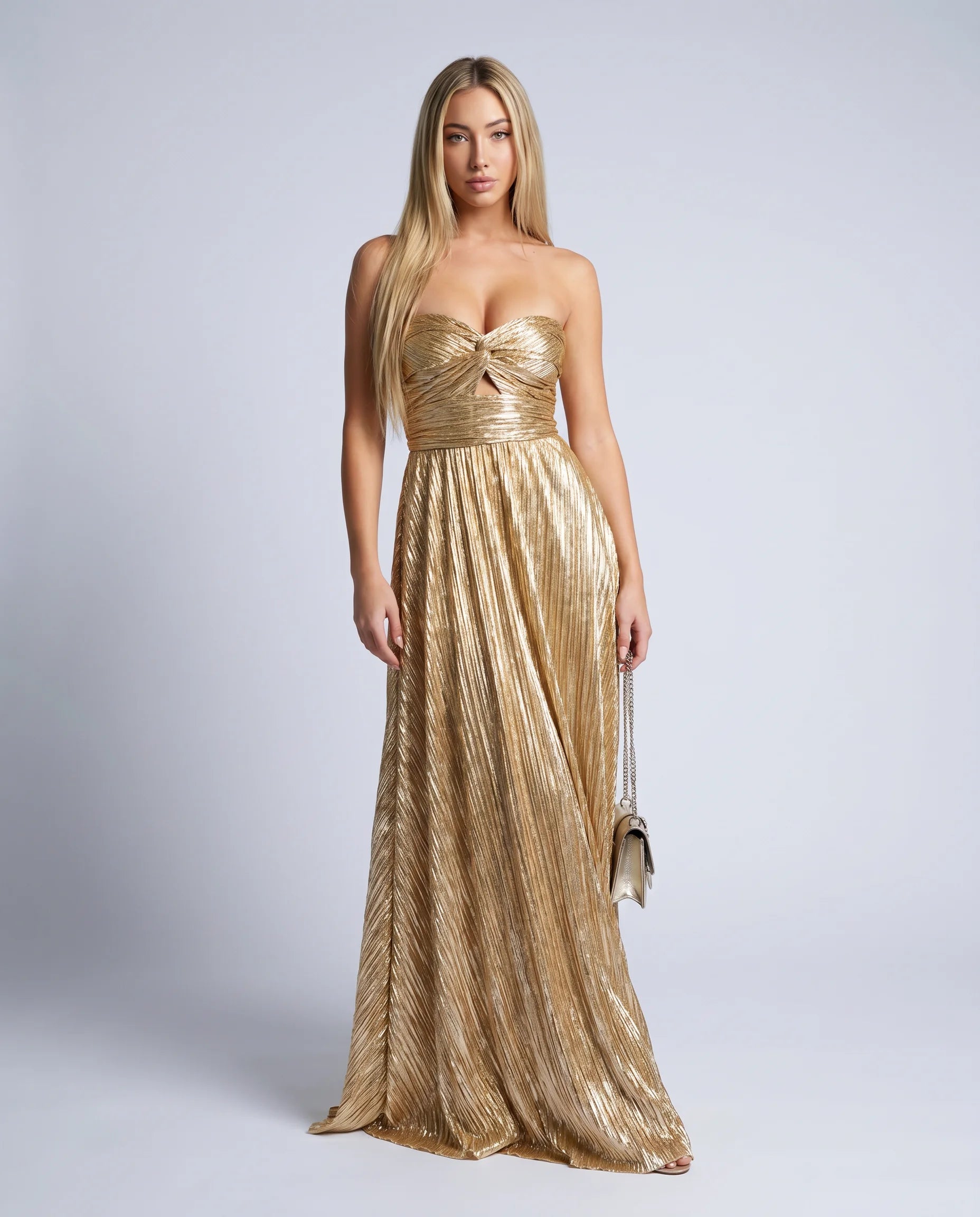 Gold metallic pleated maxi dress with strapless neckline and elegant evening wear silhouette by ILYNORA