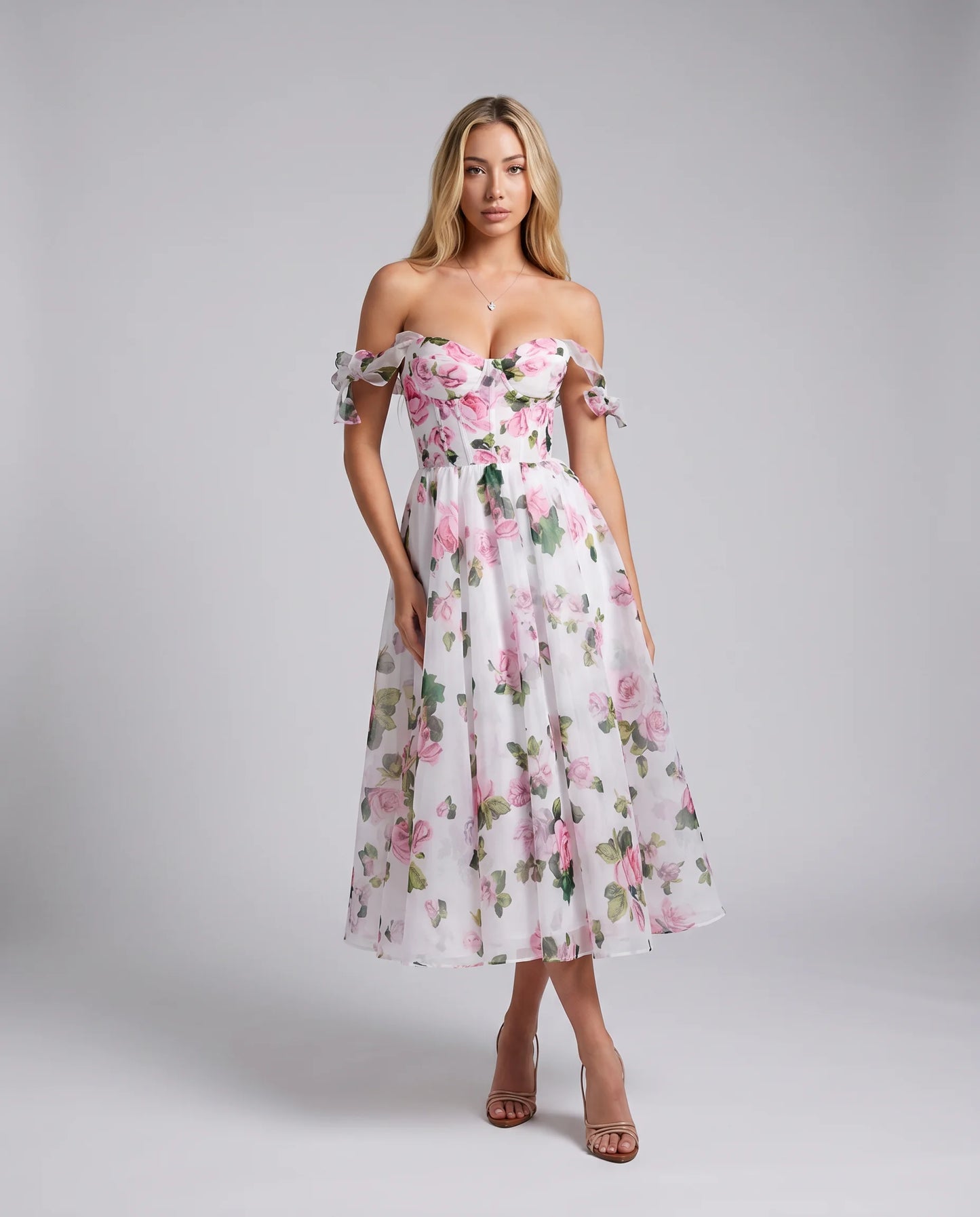 Pink floral midi dress with off shoulder neckline and flowing A-line skirt for summer weddings by ILYNORA