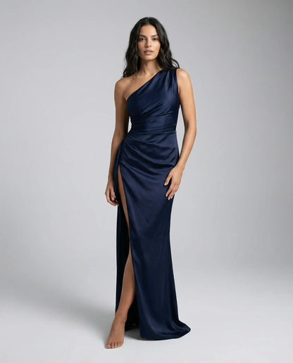 Women's one-shoulder satin maxi dress in navy by Ilynora, back view with sleek satin finish and elegant silhouette