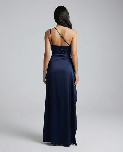 Navy one-shoulder satin maxi dress for women by Ilynora, back view highlighting sleek silhouette and smooth satin drape