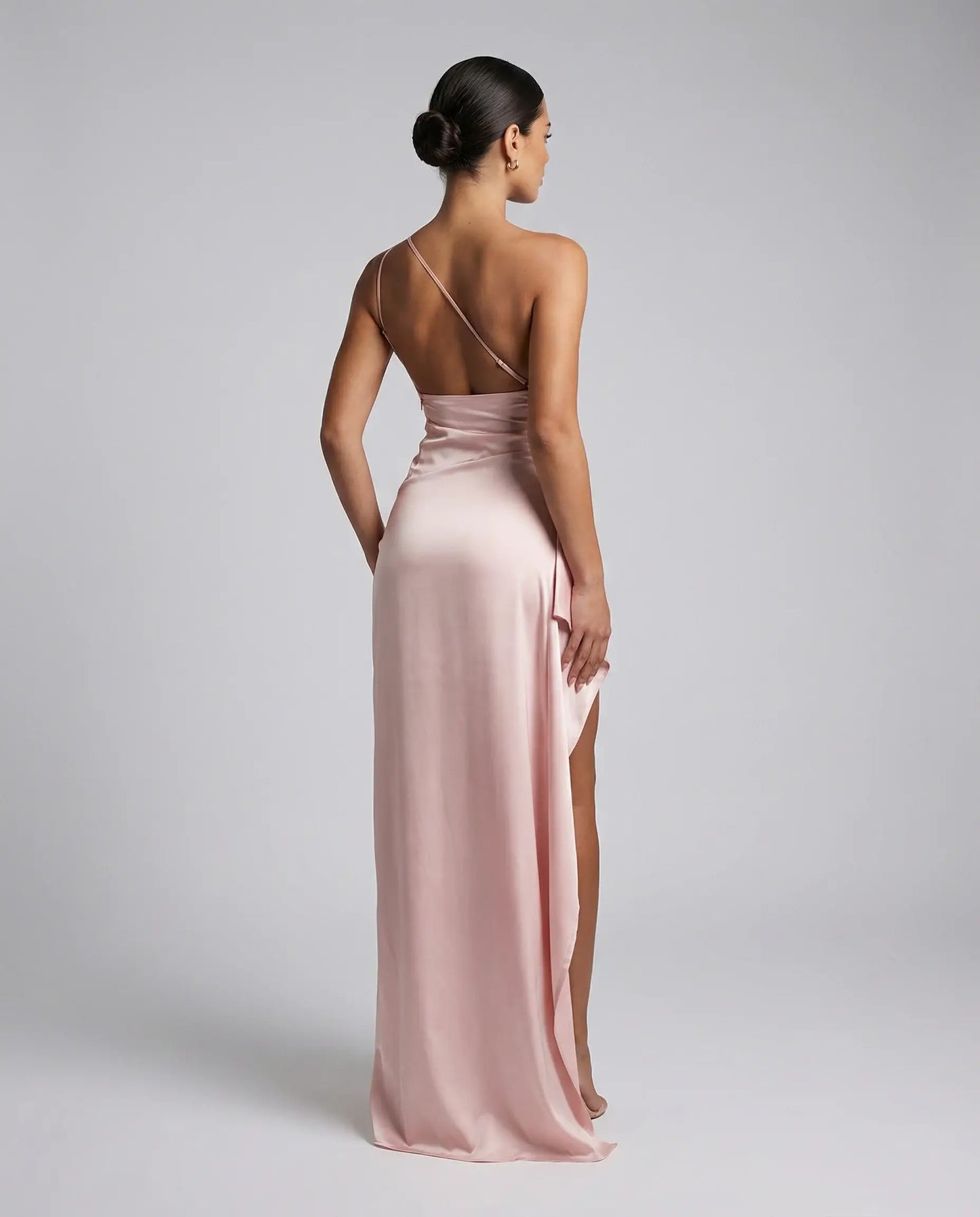 Pink one-shoulder satin maxi dress for women by Ilynora, back view highlighting feminine silhouette and soft sheen