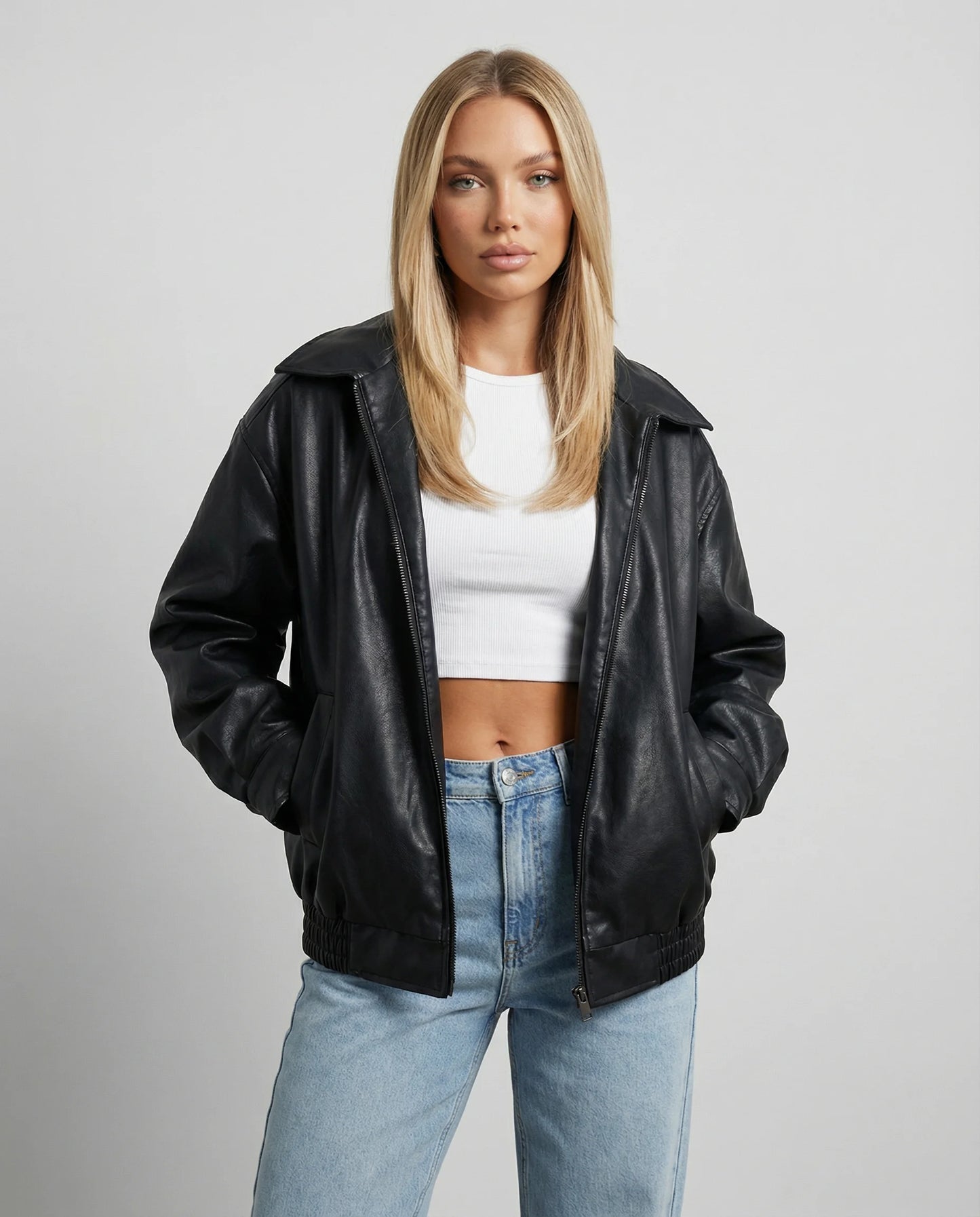 Women's oversized leather jacket in black by Ilynora, front view with relaxed fit and structured silhouette