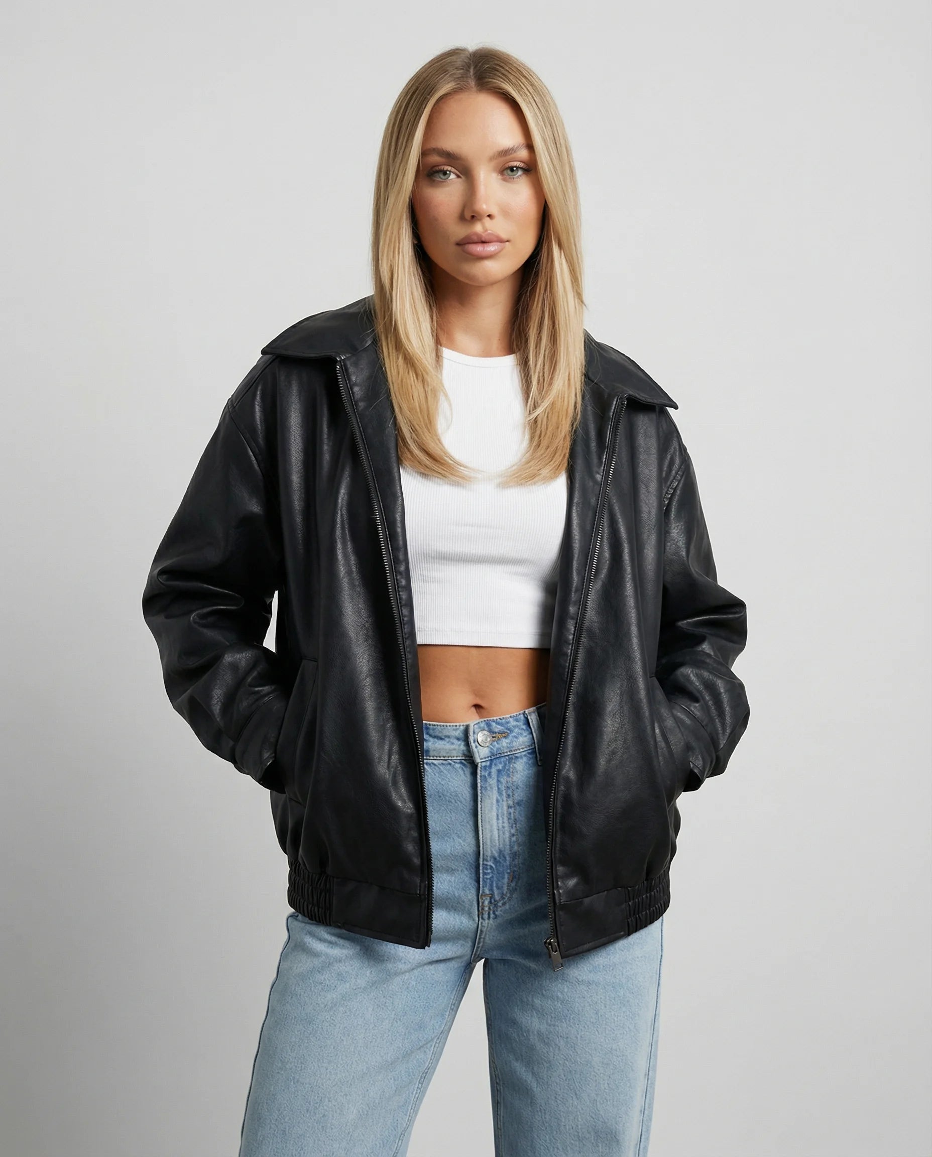 Women's oversized leather jacket in black by Ilynora, front view with relaxed fit and structured silhouette