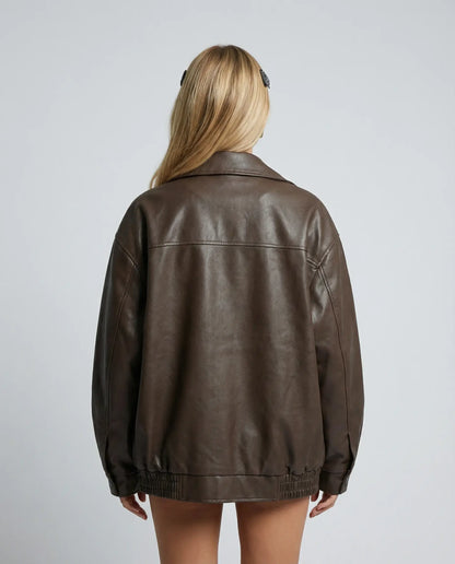 Brown oversized leather jacket by Ilynora, back view showing loose fit and minimal design