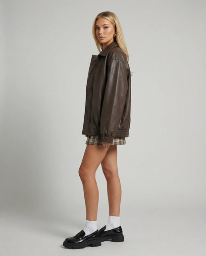 Oversized leather jacket in brown by Ilynora, angled view highlighting structure and modern cut