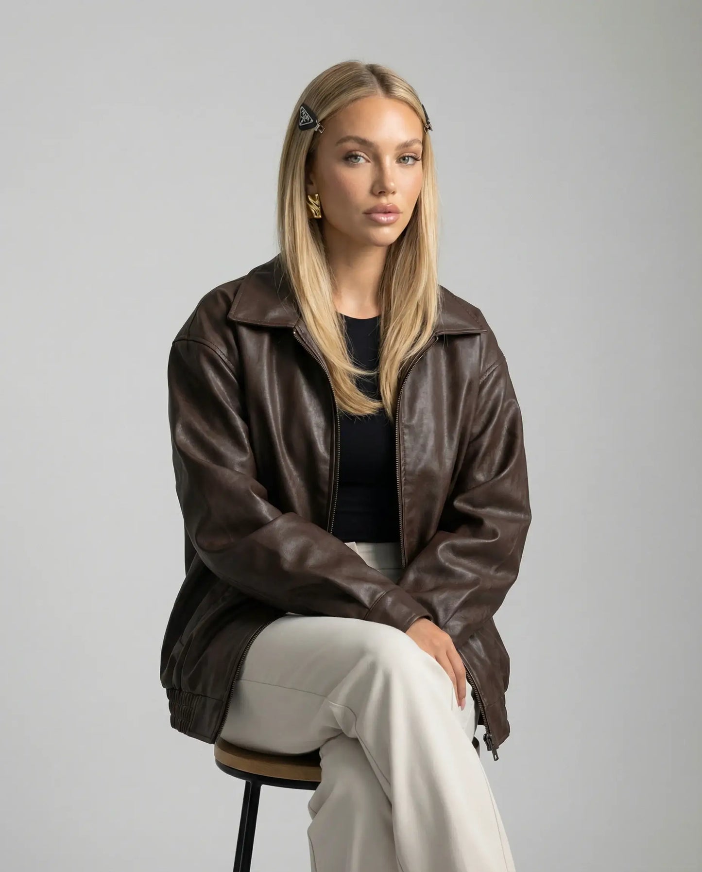Brown leather jacket by Ilynora, full body view with oversized fit and effortless styling